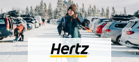 Hertz logo over picture of woman at ski parking lot