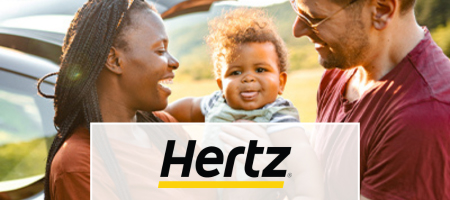 Hertz. Happy family smiling in front of a car
