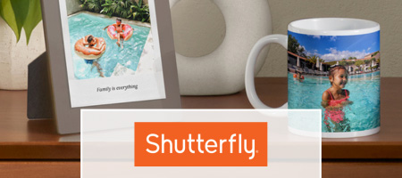 Shutterfly. A picture frame and a coffee mug on a table.